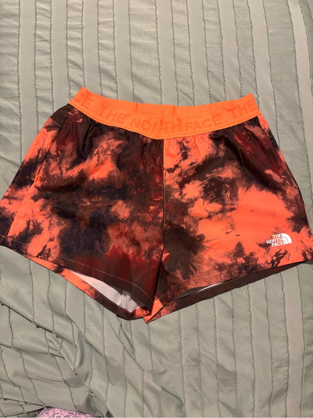 The North Face Women’s Orange and Black Tie-Dye Athletic Wonder Shorts